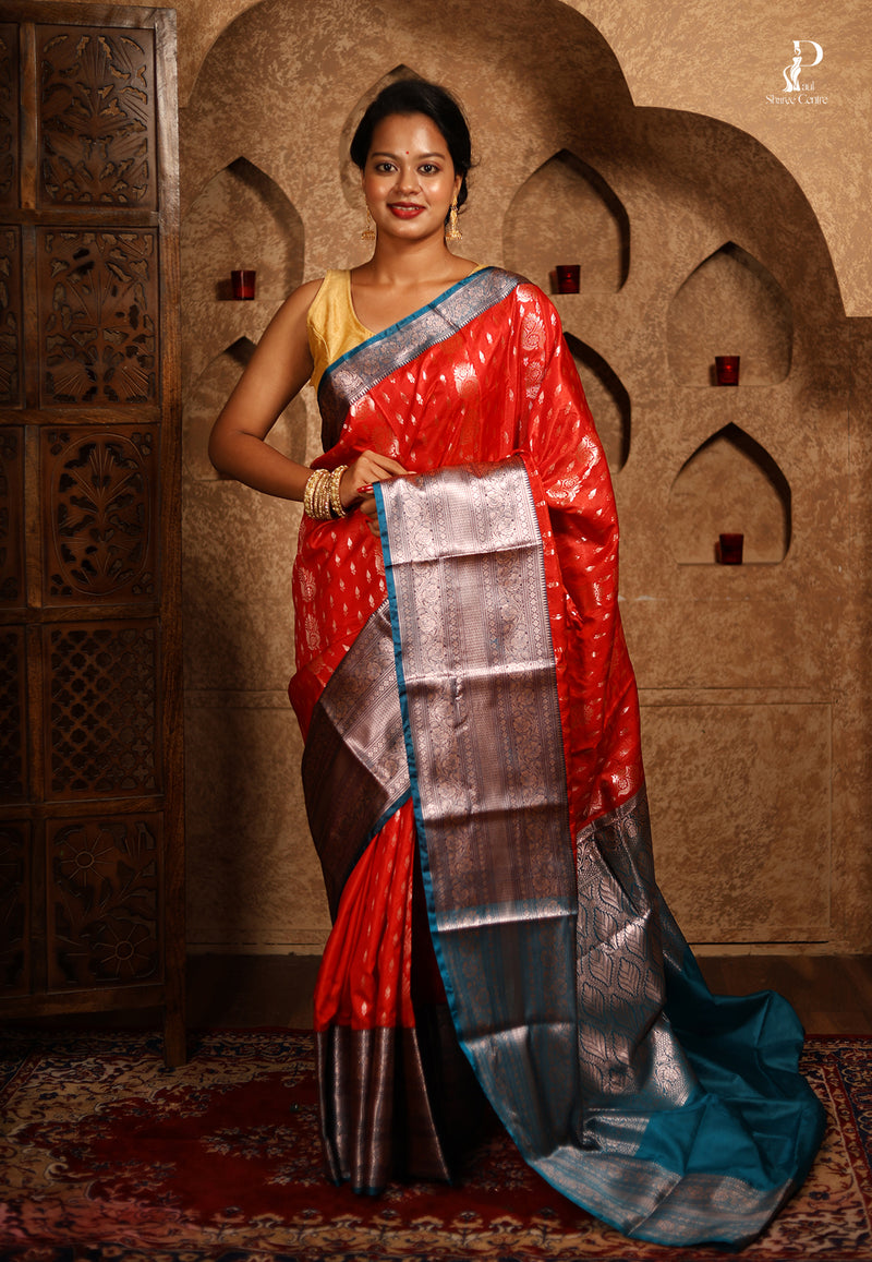 Orangish Red Satin Pattu Kanjivaram Saree with Teal Blue Border