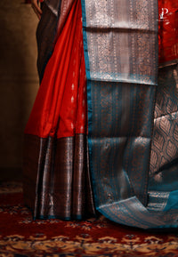 Orangish Red Satin Pattu Kanjivaram Saree with Teal Blue Border